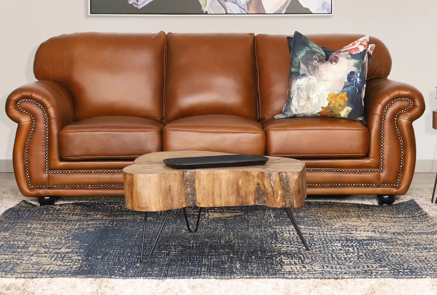 Contemporary wooden coffee table from Leather Gallery styled in a lounge.