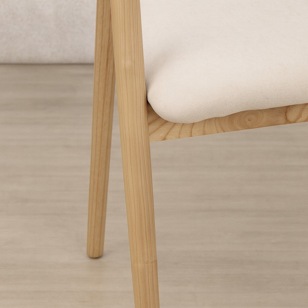 Close up of the sturdy wooden legs on the Alden Fabric Dining Chair.