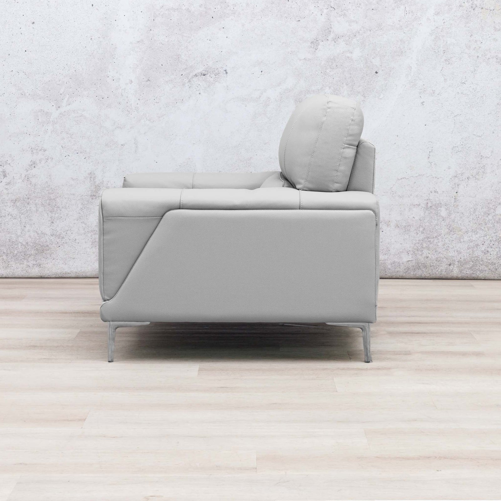 Side view of the Leather Gallery Atlanta 1 Seater Leather Couch in Luxe Beige, featuring a low-profile design and slim metal legs.