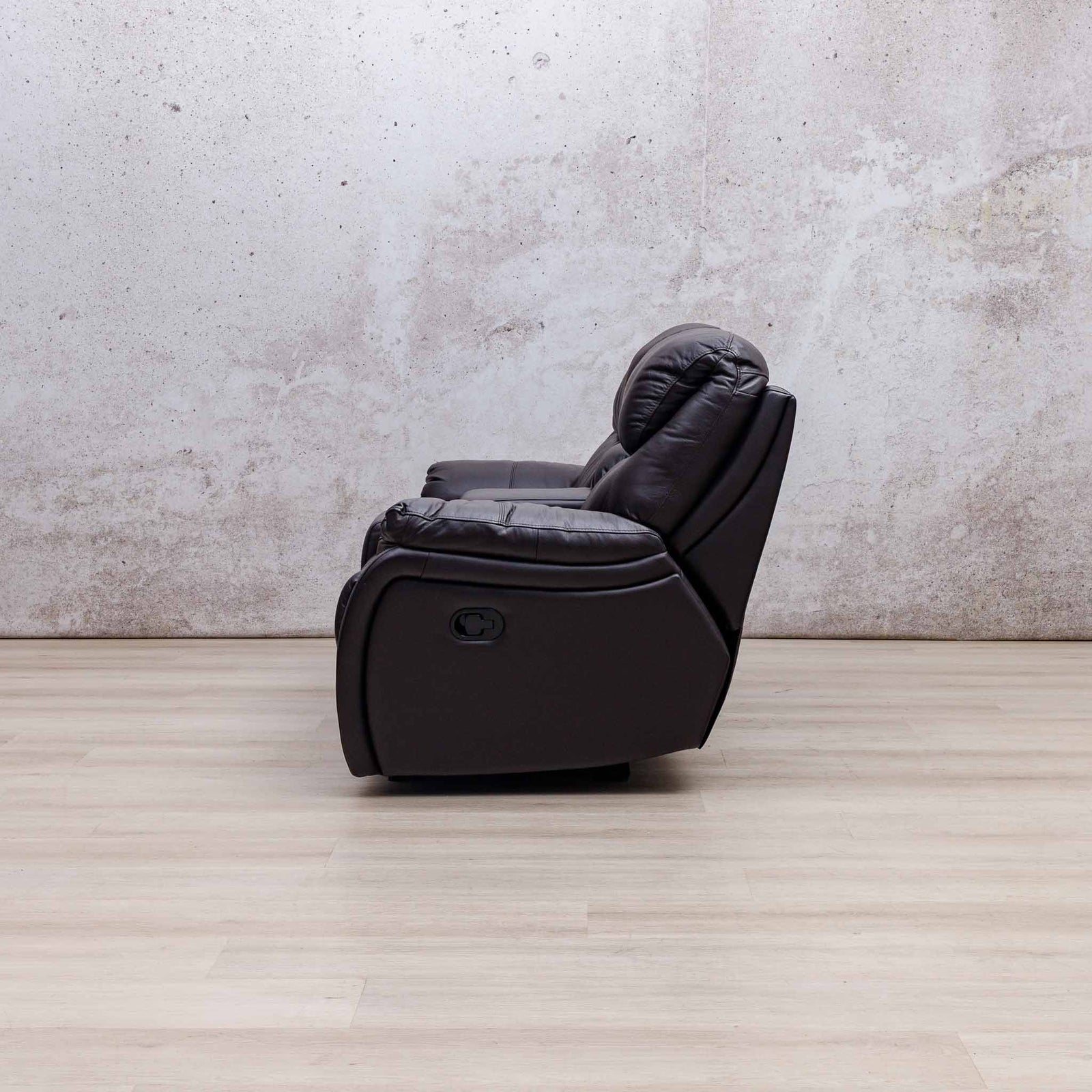 Side view of the Leather Gallery Cairo 2 Seater Leather Recliner in Choc, showing its leather upholstery and recliner profile.