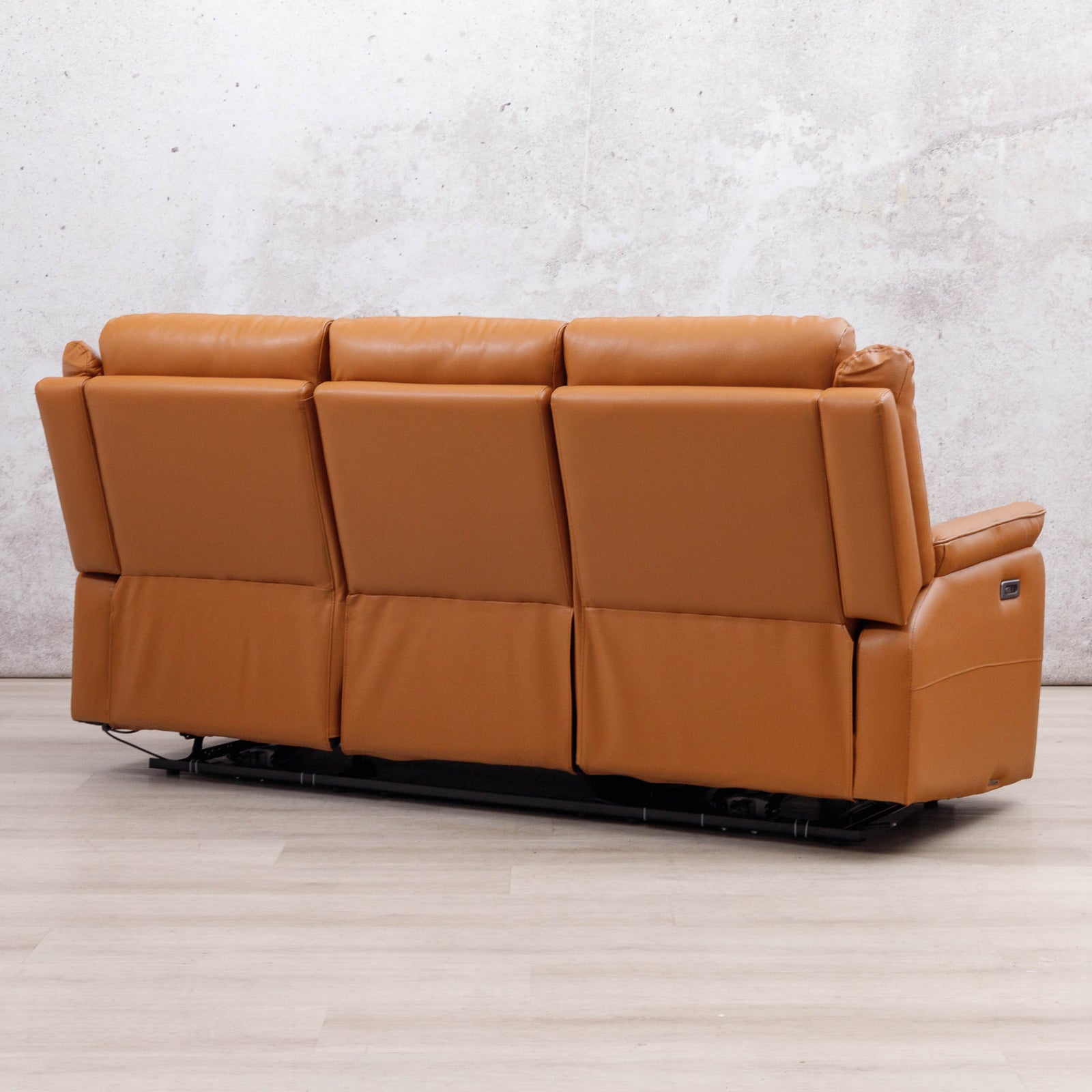 Rear three-quarter view of the Leather Gallery Carter 3 Seater Leather Recliner in Tan, showing its leather upholstery and reclining design.