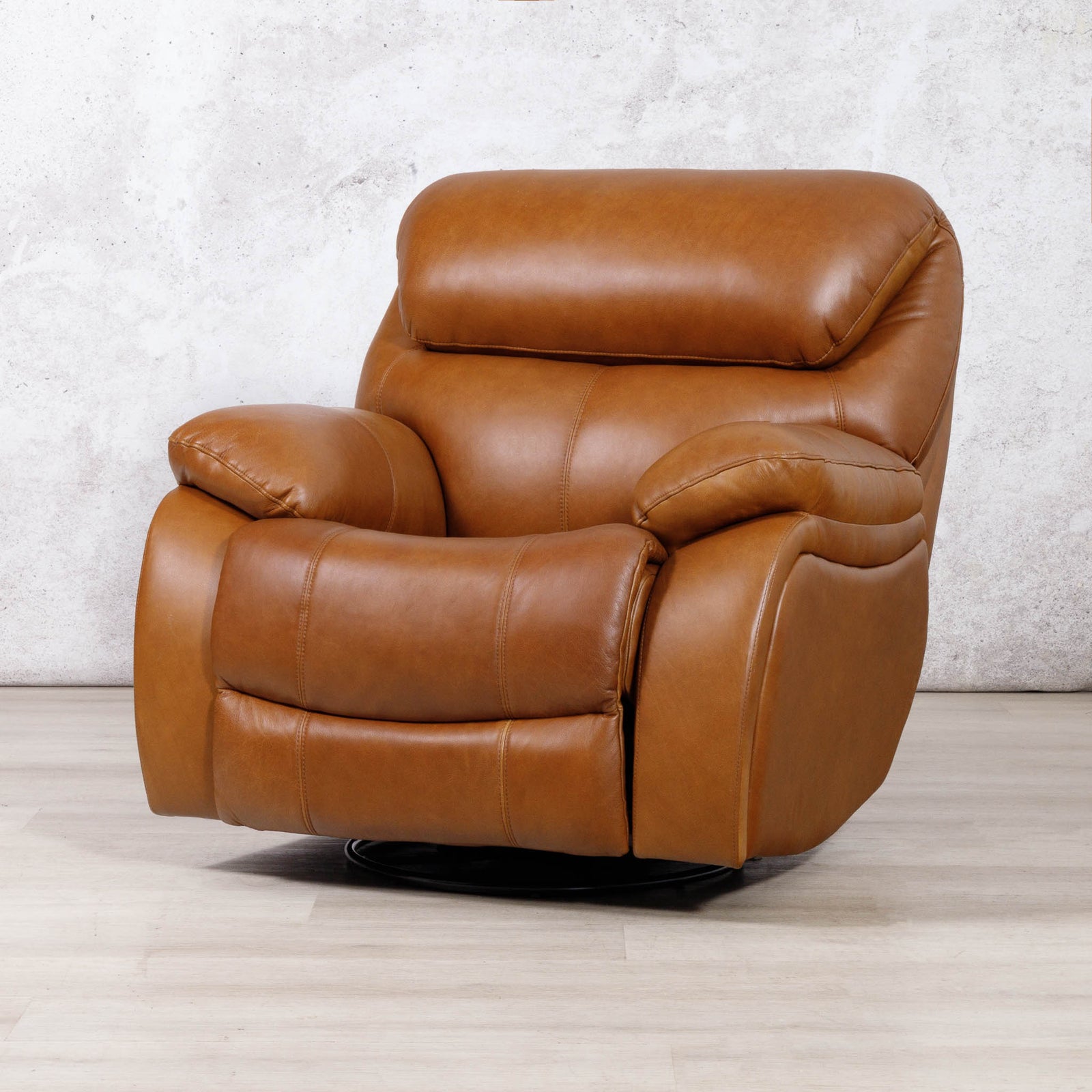 Leather Gallery Kuta 1 Seater Leather Recliner in Czar Pecan, featuring tan leather upholstery and a black swivel base.