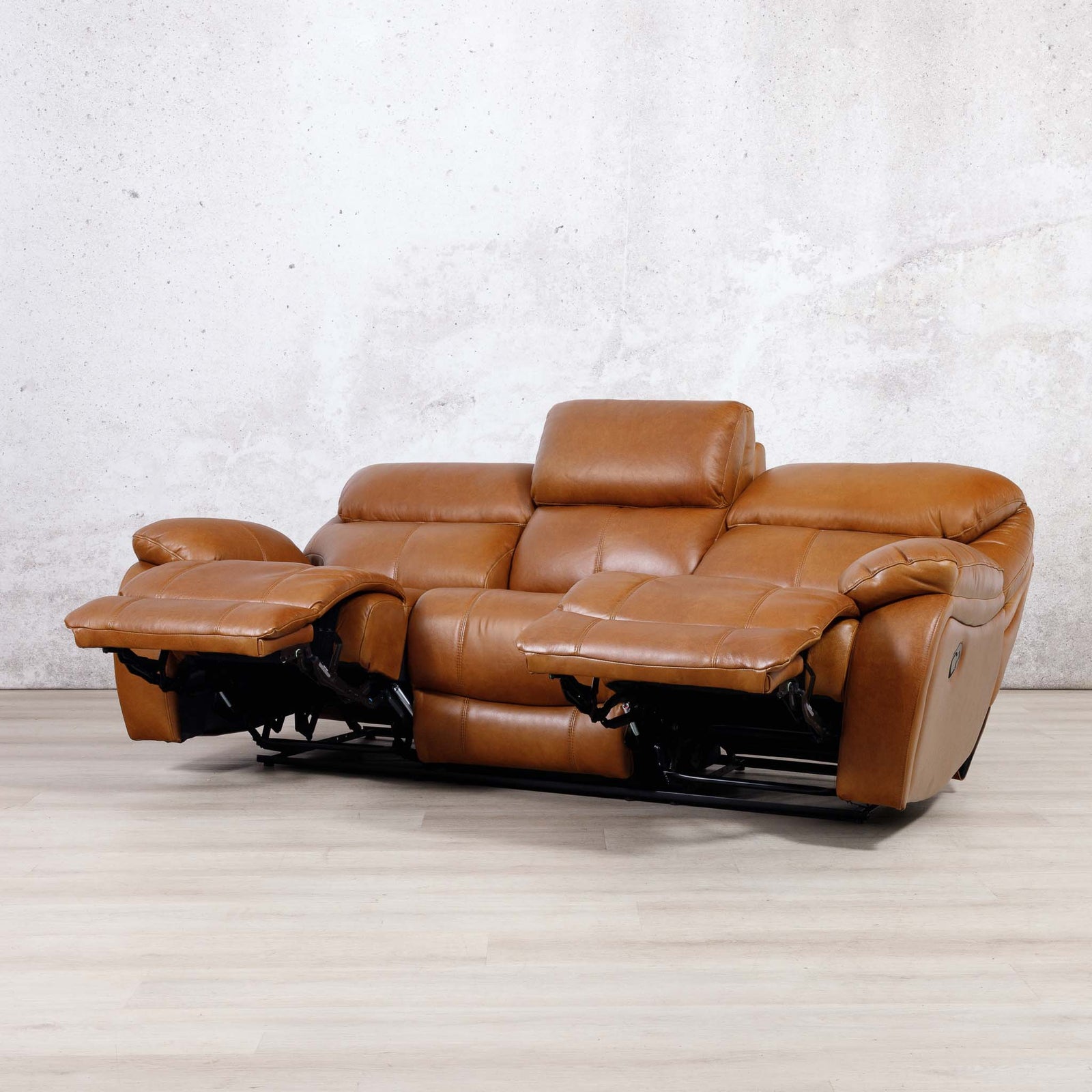 Leather Gallery Kuta 3 Seater Leather Recliner in Czar Pecan, shown with the footrests extended.