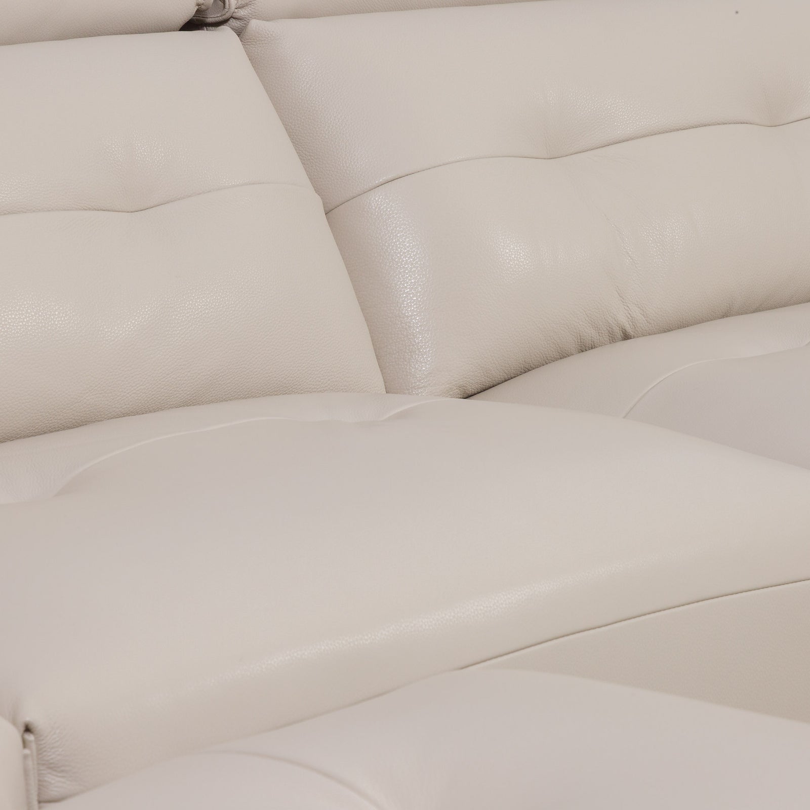 Close-up of the Leather Gallery Marbella 5 Seater Leather L Shape Couch in Cream Beige, showing tufted back cushions and smooth leather upholstery.