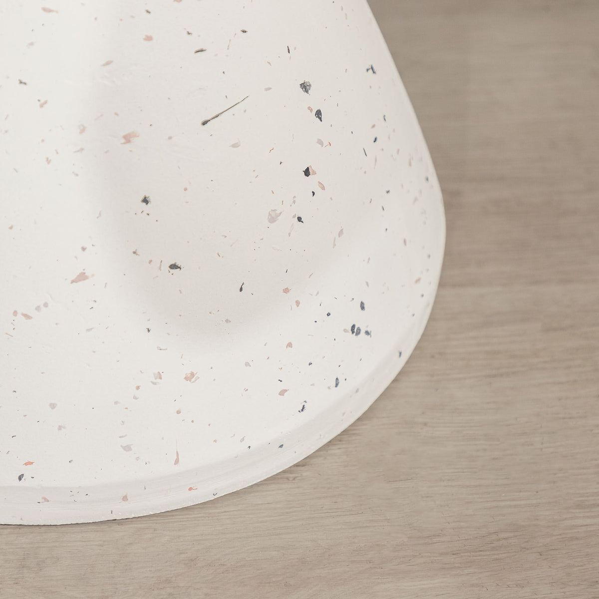 Gallery Everyday Marielle Side Table in Stone, featuring a round concrete design with a speckled beige finish.