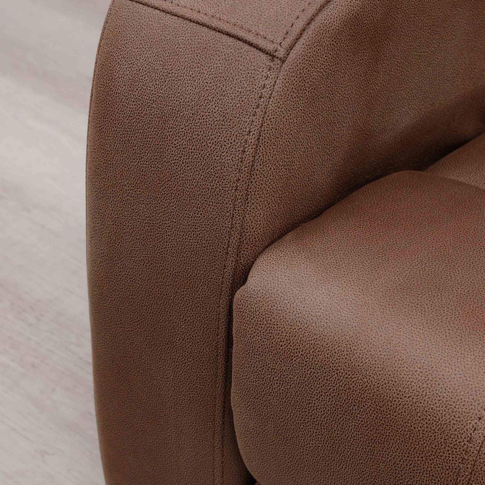 Close-up of the Leather Gallery Orlando 1 Seater Fabric Recliner in Desert Sand, showing the textured upholstery grain and stitching detail.