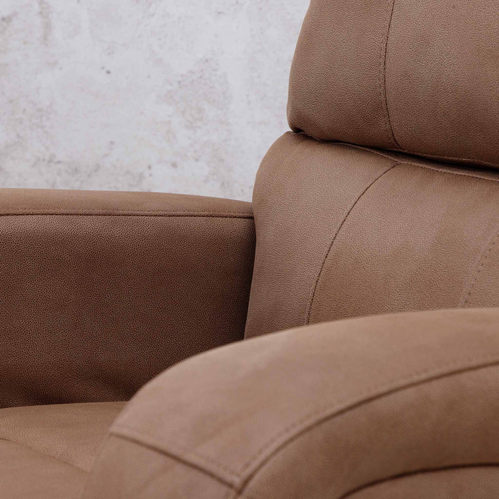 Close-up of the Leather Gallery Orlando 1 Seater Fabric Recliner in Desert Sand, showing the seat, backrest, armrest, and visible stitching.