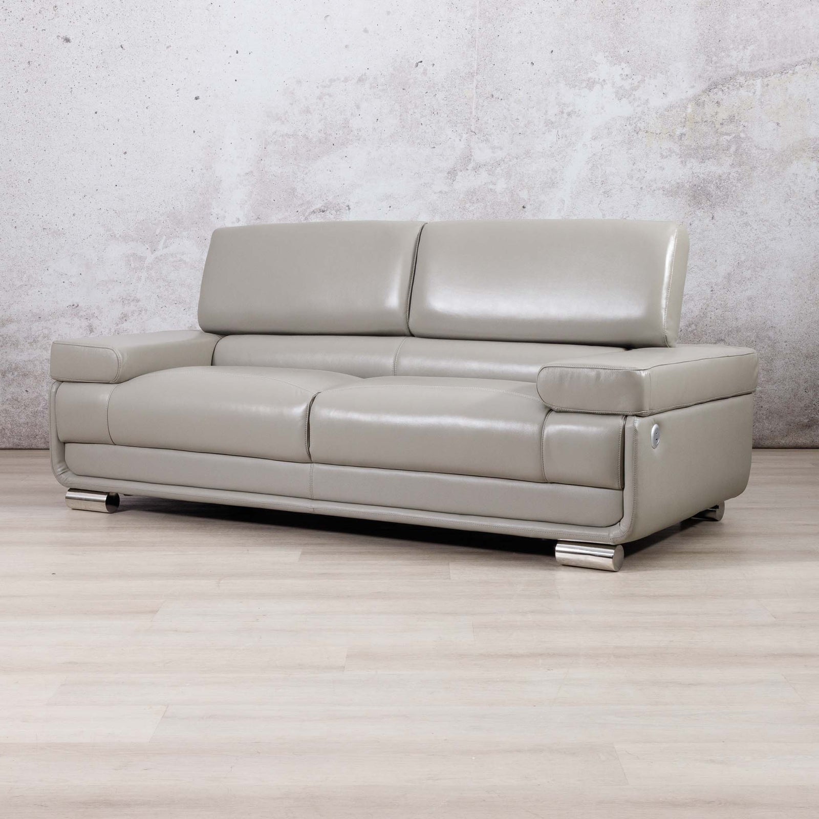 Three-quarter view of the Leather Gallery Tobago 3 Seater Leather Couch in Grey, showing its modern leather upholstery and low-profile design.