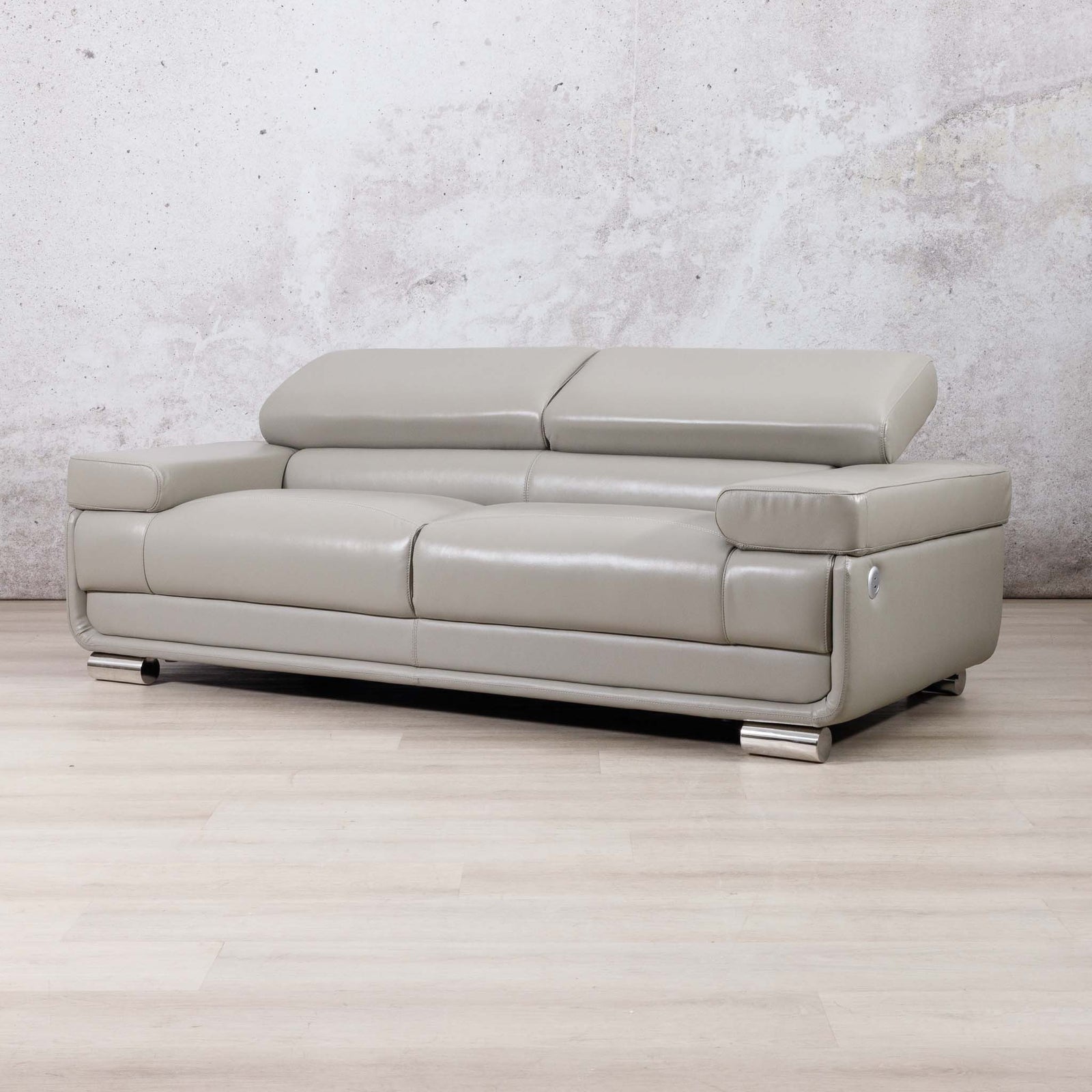 Leather Gallery Tobago 3 Seater Leather Couch in Grey, featuring a low-profile design with a metallic silver frame and feet.