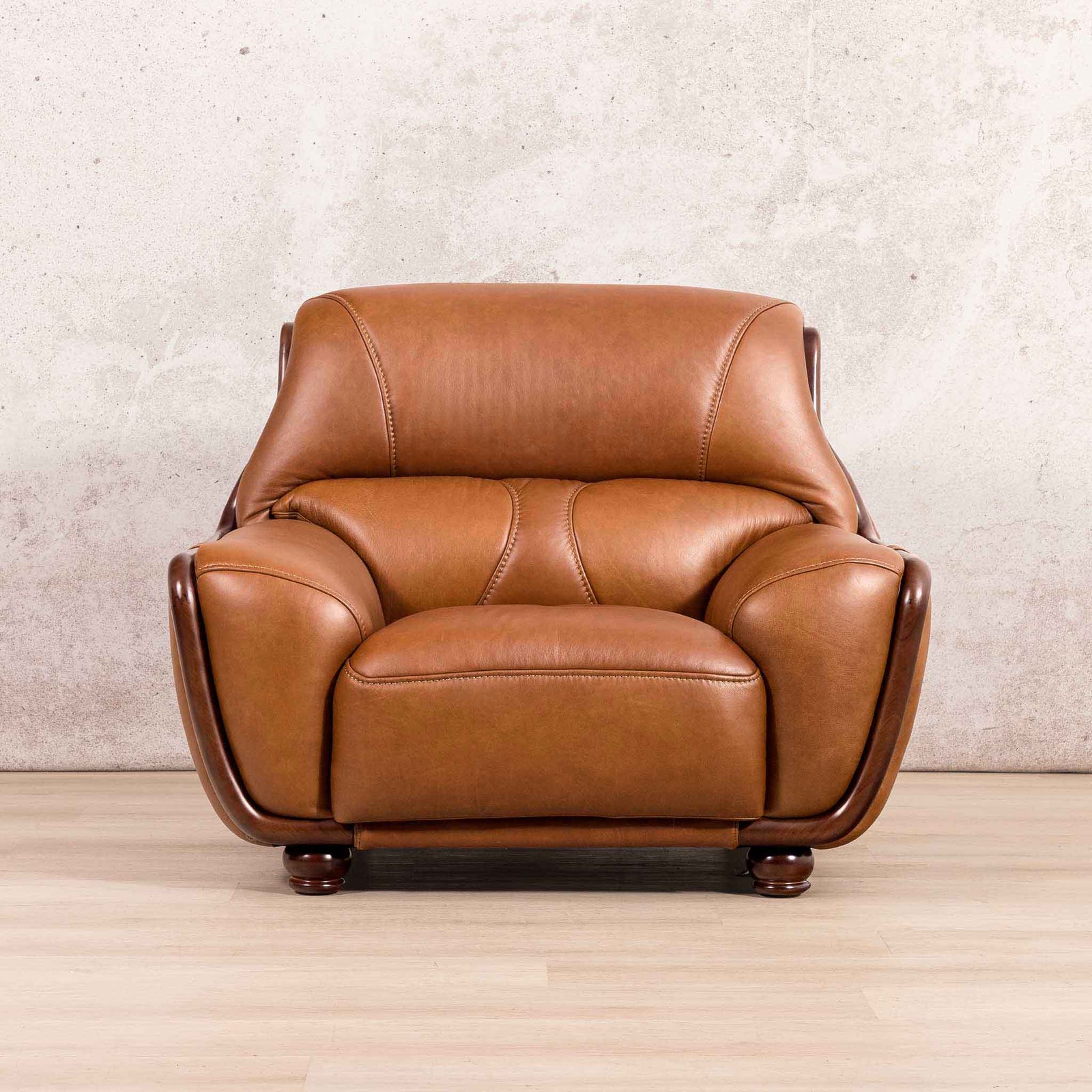 Leather Gallery Zuri 1 Seater Leather Couch in Czar Pecan, featuring dark wood legs and a modern armchair design.