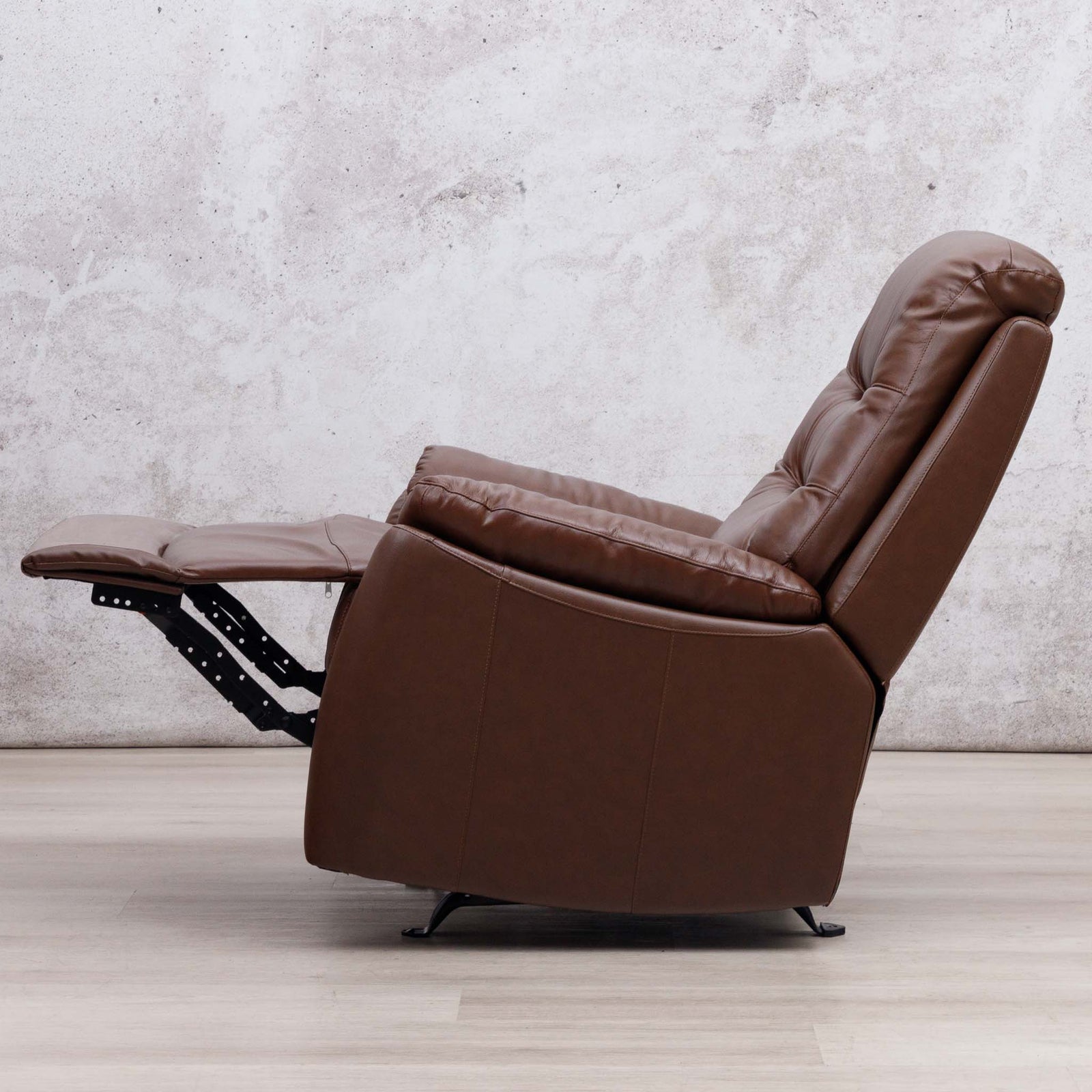 Leather Gallery Dallas Leather Rocker Recliner Chair in Saddle, shown with the footrest extended.