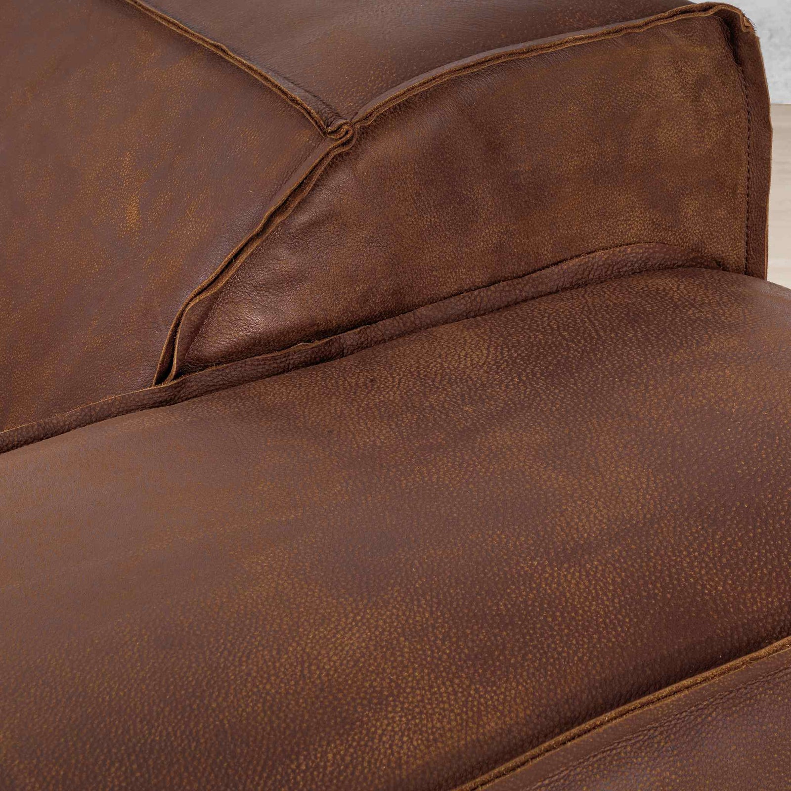 Austin Close up Leather Couch in Woodlands Spice, in a bright, modern-minimalist styled living room. Genuine leather couches.