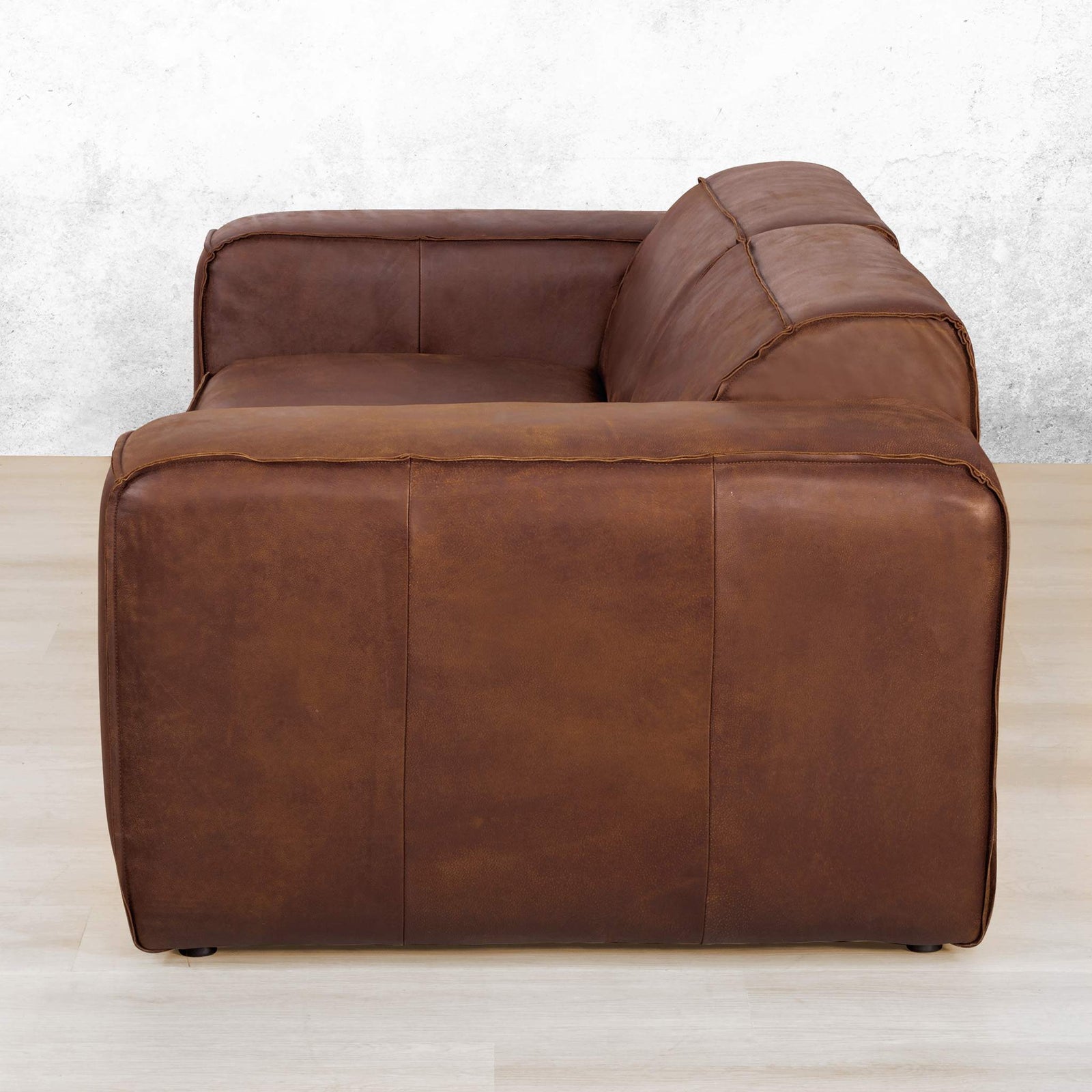 Austin 3 Seater Leather Couch in Woodlands Spice, in a bright, modern-minimalist styled living room. Genuine leather couches.