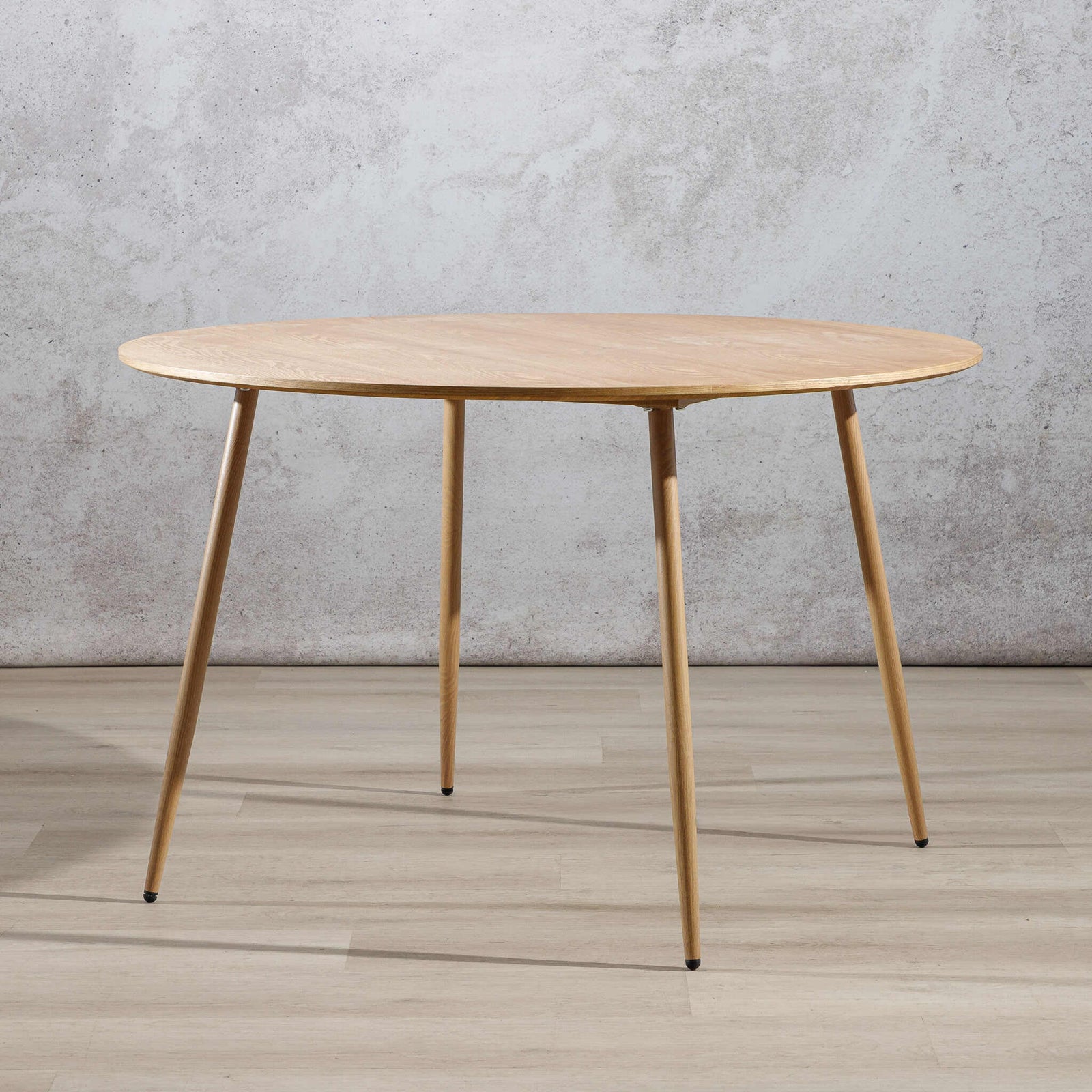 Beckett 4 seater dining table in natural wood with tapered legs, angled view. | wood dining table, 4 seater dining table, dining tables, kitchen table