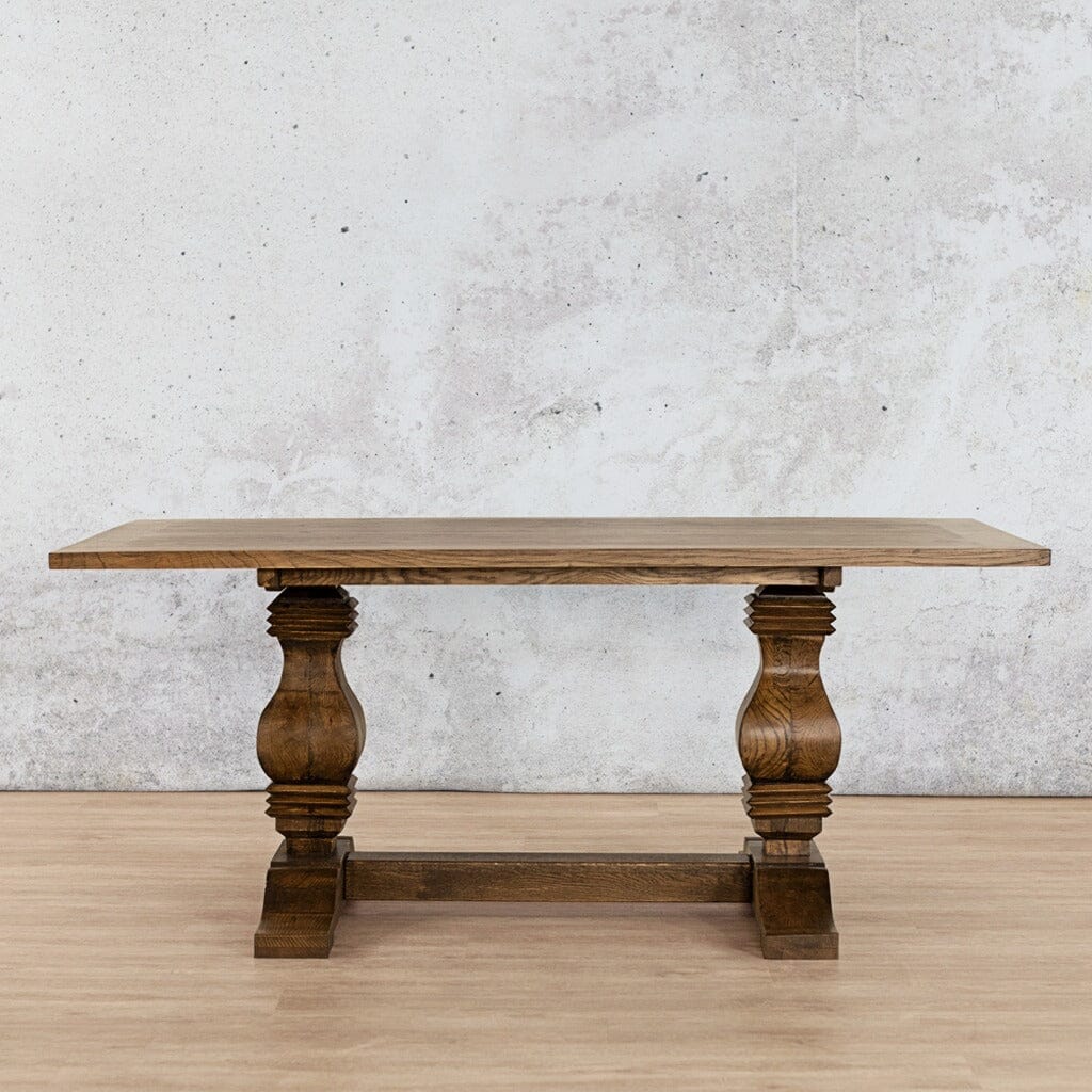 Front view of the Belmont Wood Top Dining Table – 2.4m in Antique Dark Oak, showcasing the table’s bold, sophisticated design and sturdy wood construction. Leather Gallery