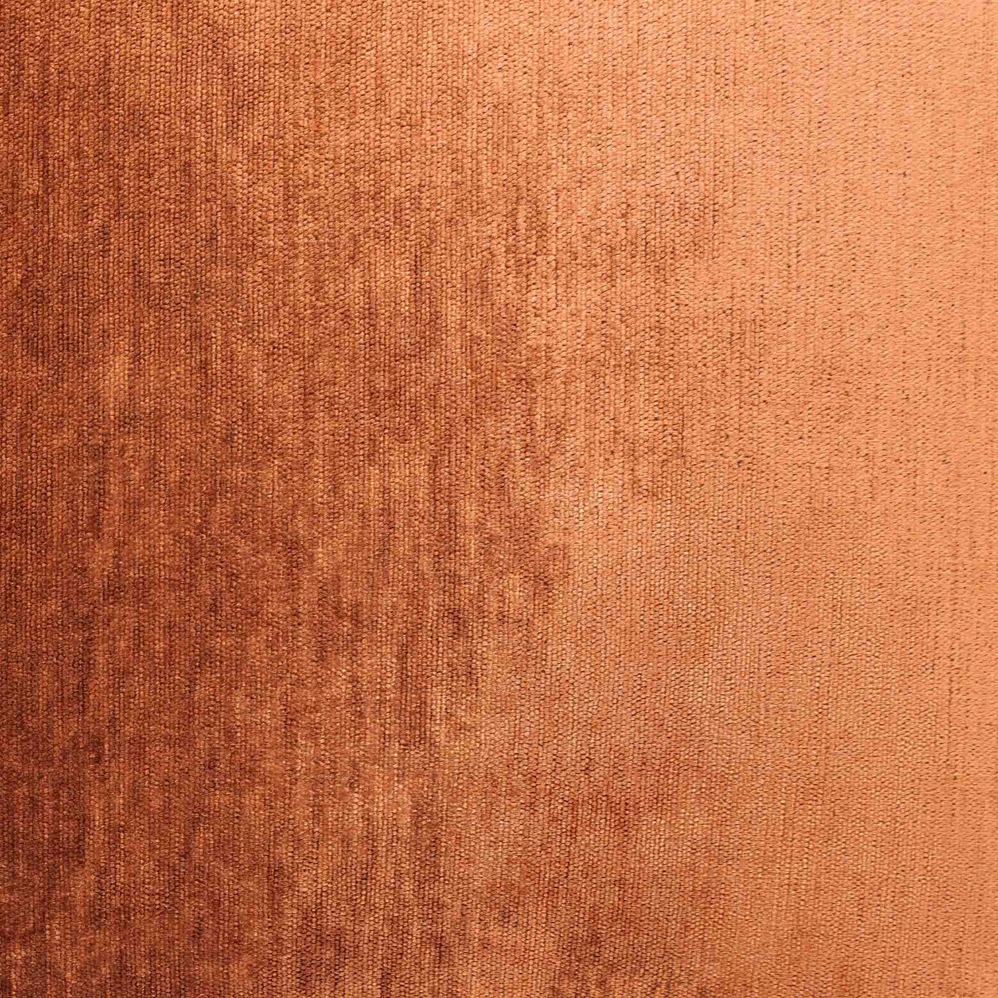 Close-up of the Leather Gallery Vista Plateau Cushion in Burnt Clay, showing the textured fabric in warm copper and rust tones.