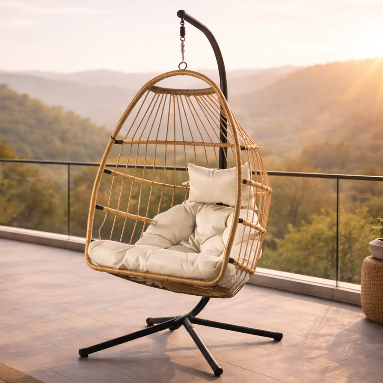 Madison Hanging Chair in beige, shown in a serene, outdoor patio space. | Outdoor chairs, hanging chair, patio furniture, patio chairs for sale