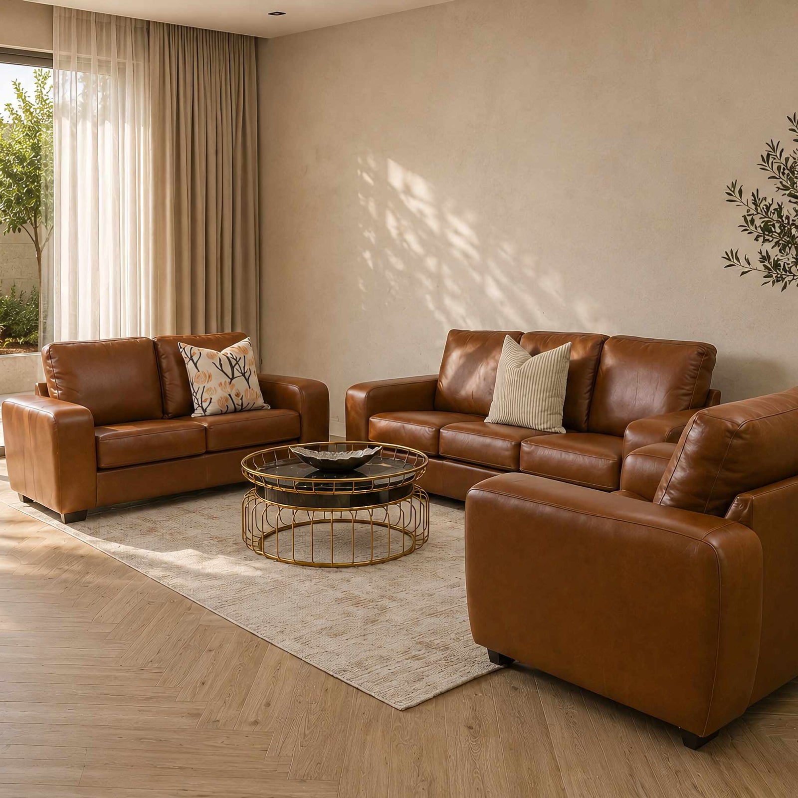 Stanford three-seater couch in tan top-grain genuine leather. Featuring a modern boxy silhouette, this brown leather couch includes full high-density foam seats and wooden legs. Czar Pecan