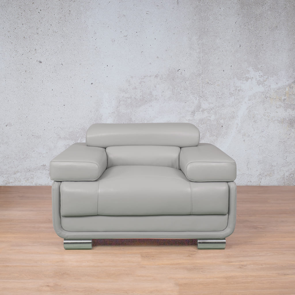 Front-facing view of a grey leather couch, the Tobago, with its adjustable headrest folded down for a sleek, streamlined look.