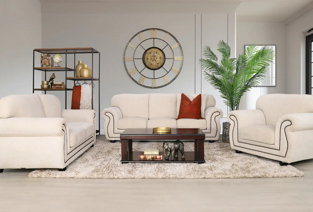 Explore the Isilo 3+2+1 Fabric Sofa Suite with soft, supportive foam cushions and stylish metallic stud detailing on its scrolled armrests.