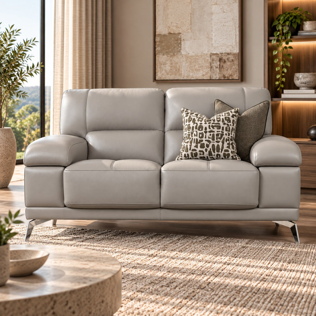 Leather Gallery Adaline 2 Seater Leather Couch in Luxe Grey, featuring light grey leather upholstery and decorative cushions in a bright modern living room.