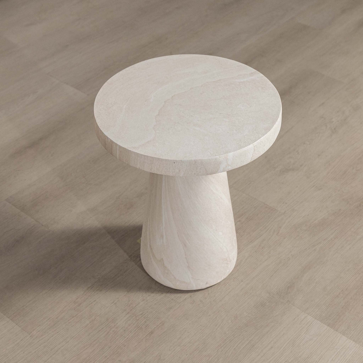 Gallery Everyday Angelo Side Table in Lunar Quartz, featuring a round stone top and tapered pedestal base in a bright modern living room.