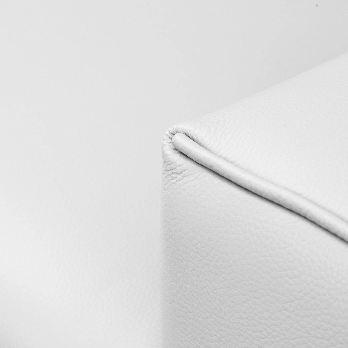 Close-up of the Leather Gallery Atlanta 1 Seater Leather Couch in Luxe Beige, showing textured leather and stitched corner seam detail.