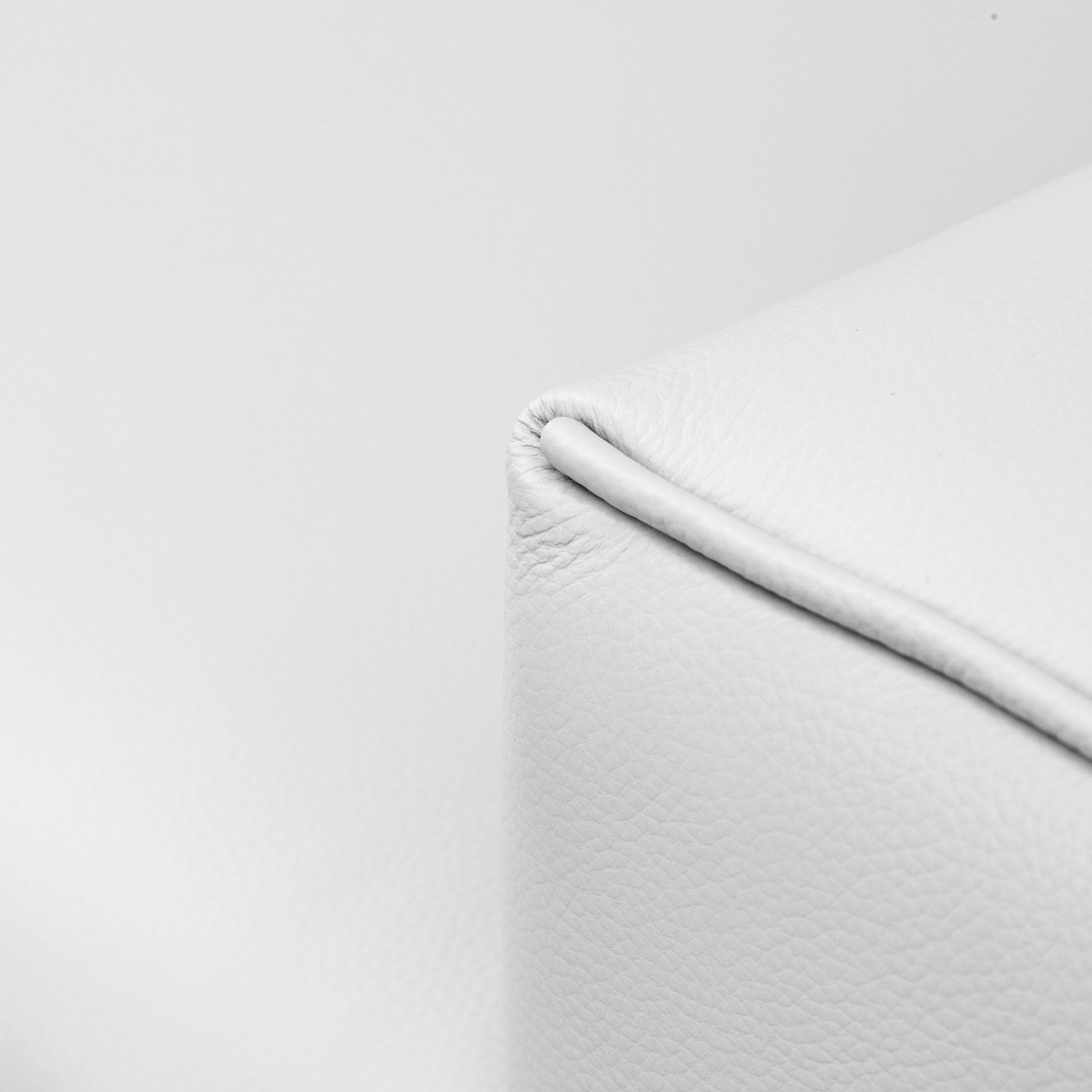 Close-up of the Leather Gallery Atlanta 3 Seater Leather Couch in Luxe Beige, showing textured leather and a stitched corner seam.