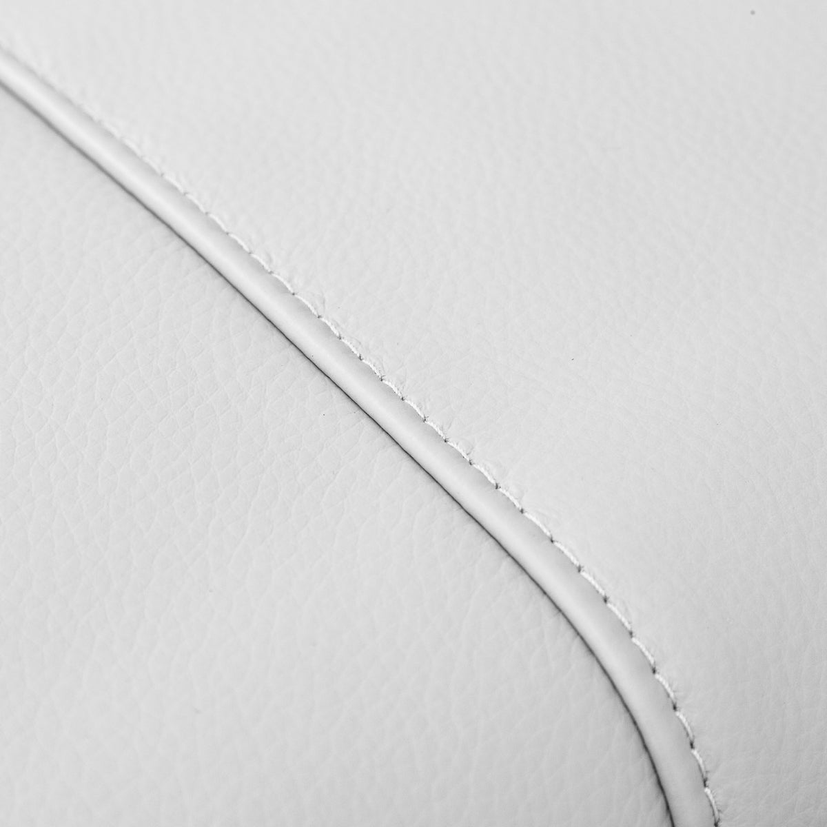 Close-up of the Leather Gallery Atlanta 1 Seater Leather Couch in Luxe Beige, showing the curved stitched leather edge.