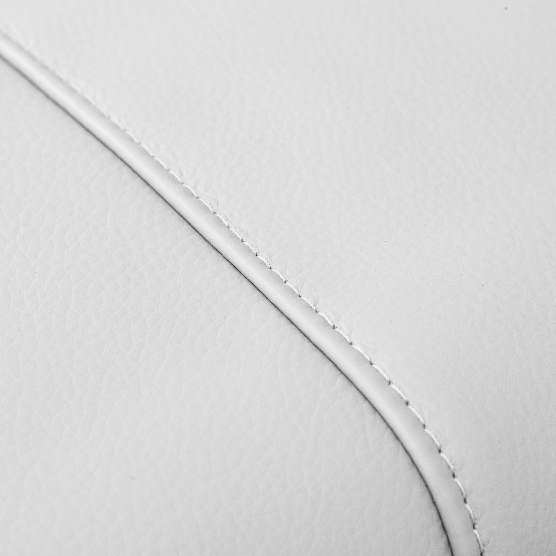 Close-up of the Leather Gallery Atlanta 3 Seater Leather Couch in Luxe Beige, showing the curved stitched leather edge.