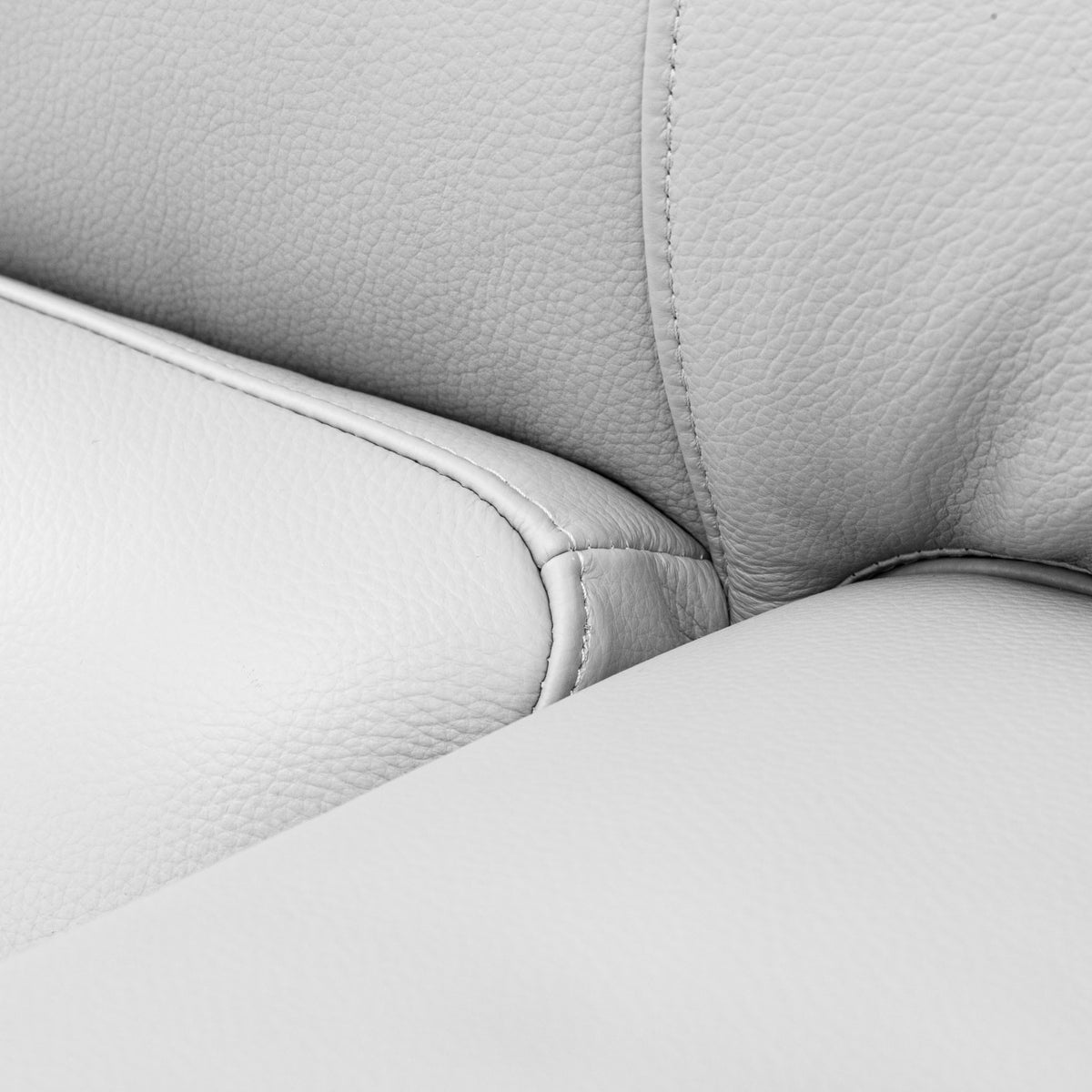Close-up of the Leather Gallery Atlanta 1 Seater Leather Couch in Luxe Beige, showing the upholstered corner and slim metal leg.