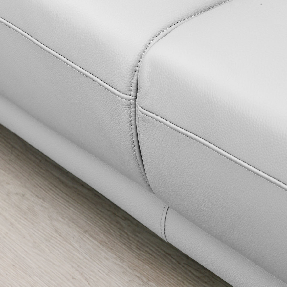 Close-up of the Leather Gallery Atlanta 1 Seater Leather Couch in Luxe Beige, showing the leather corner and visible stitching detail.