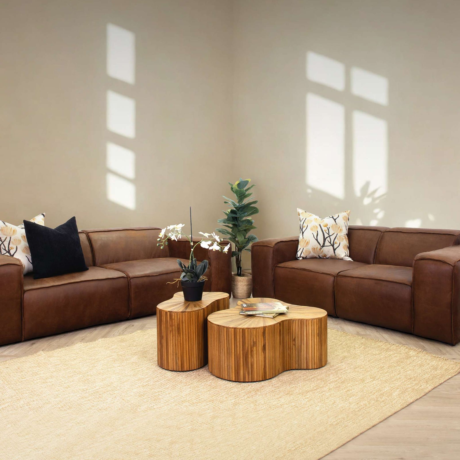 Austin 3+ 2 Leather Couch Suite in Woodlands Spice, in a bright, modern-minimalist styled living room. Genuine leather couches. 