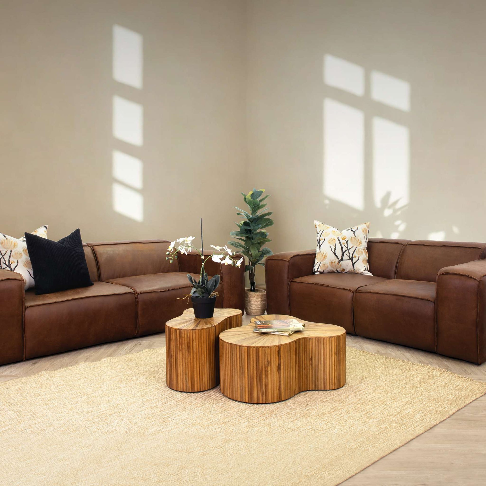 Austin 3+ 2 Leather Couch Suite in Woodlands Spice, in a bright, modern-minimalist styled living room. Genuine leather couches. 