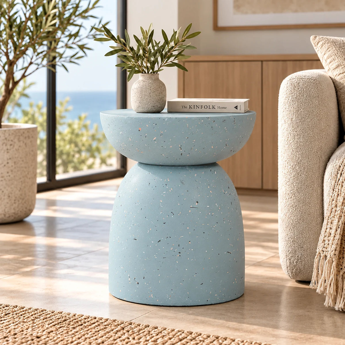Gallery Everyday Azura Side Table in Sky Mist, featuring a two-tiered concrete design with a speckled light blue finish.