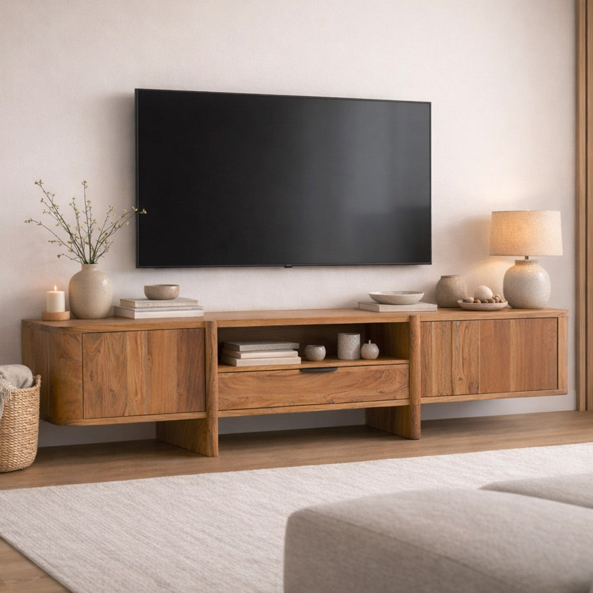 Low-profile Baltic wooden entertainment center styled in a bright living room with sunlight.