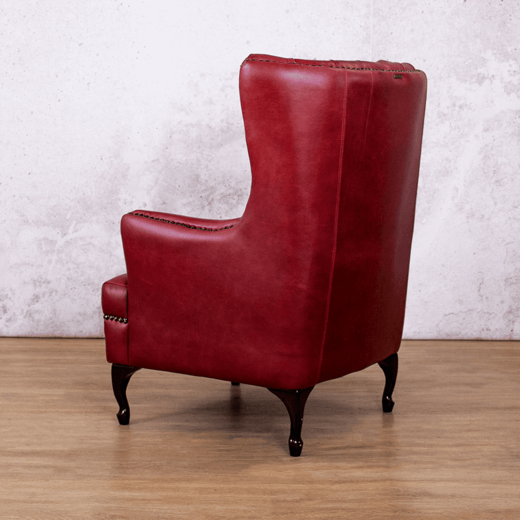 Side profile of the Royal Ruby Leather Sample of the Salina Leather Armchair with Wingback Detail | Occasional Chair Leather Gallery | Occasional Chairs For Sale