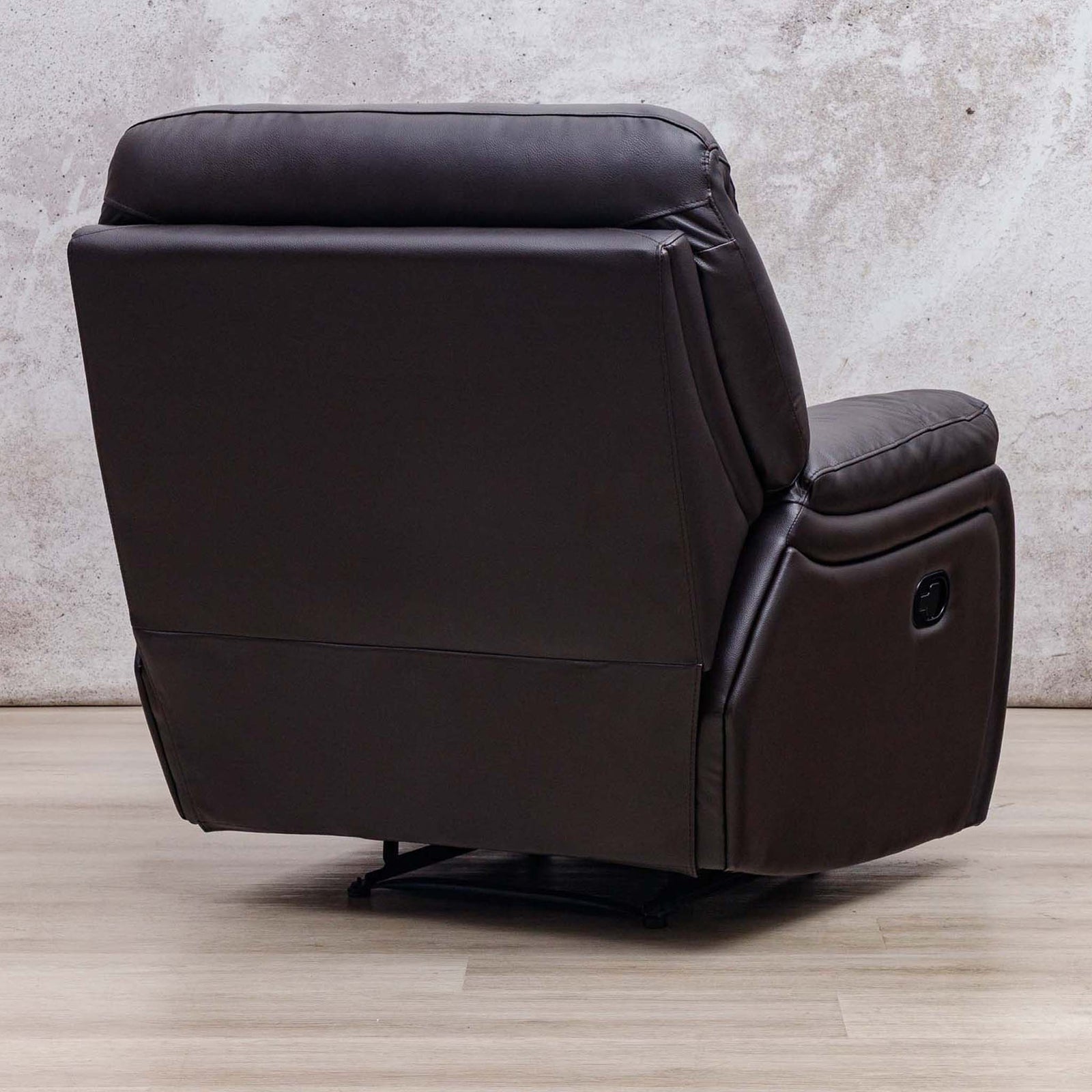 Three-quarter rear view of the Leather Gallery Cairo 1 Seater Leather Recliner in Choc, showing its leather upholstery and recliner design.
