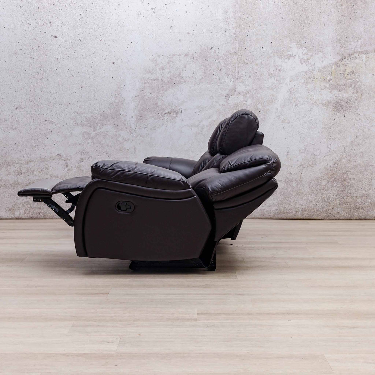 Side view of the Leather Gallery Cairo 3 Seater Leather Recliner in Choc, shown with the footrest extended.