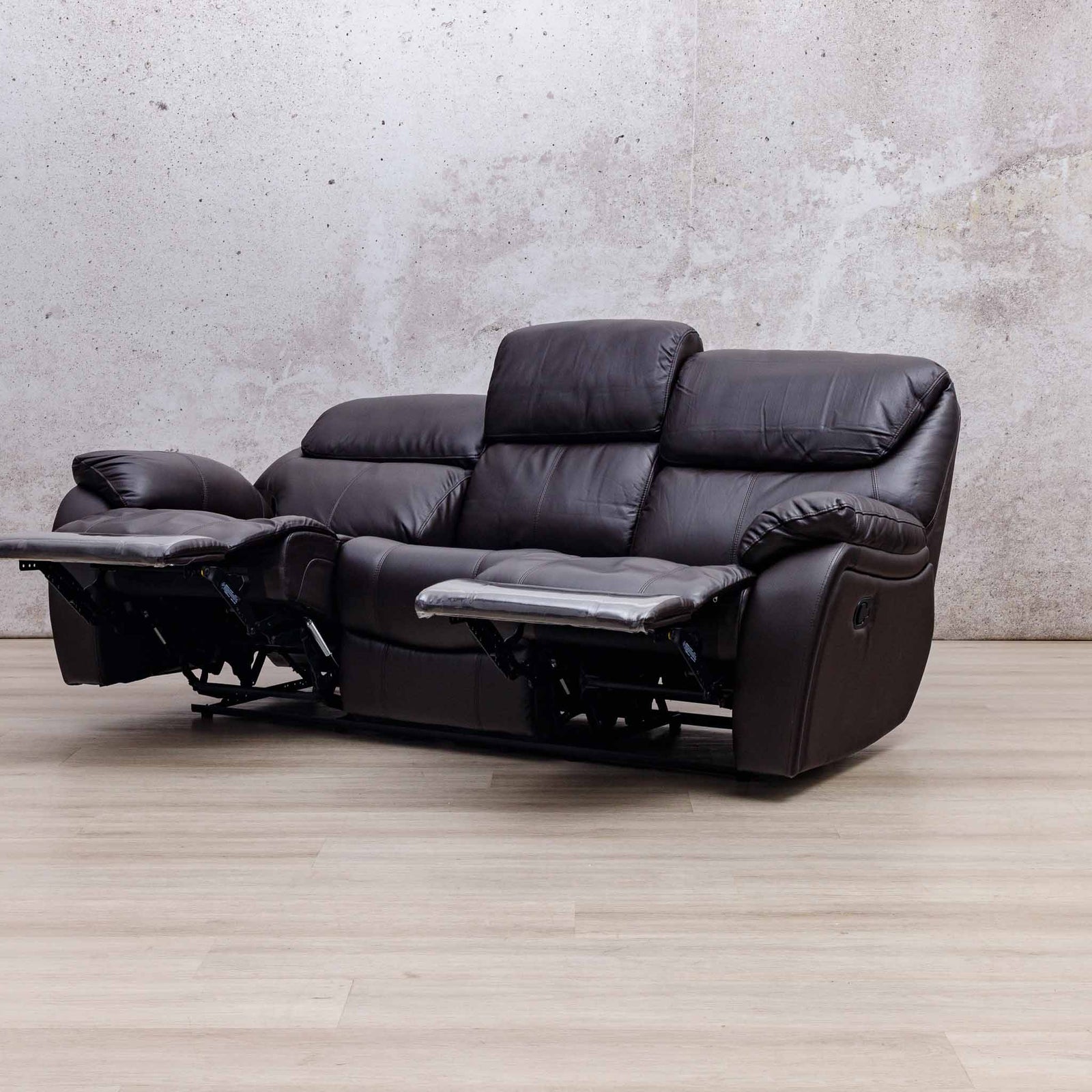 Leather Gallery Cairo 3 Seater Leather Recliner in Choc, shown with two footrests extended.