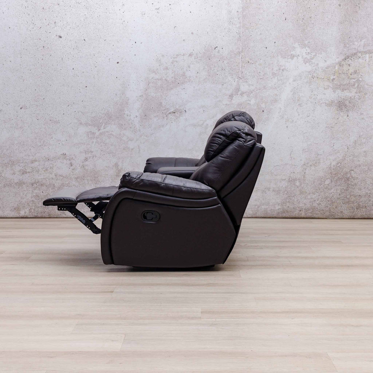 Side view of the Leather Gallery Cairo 2 Seater Leather Recliner in Choc, shown with the footrest extended.