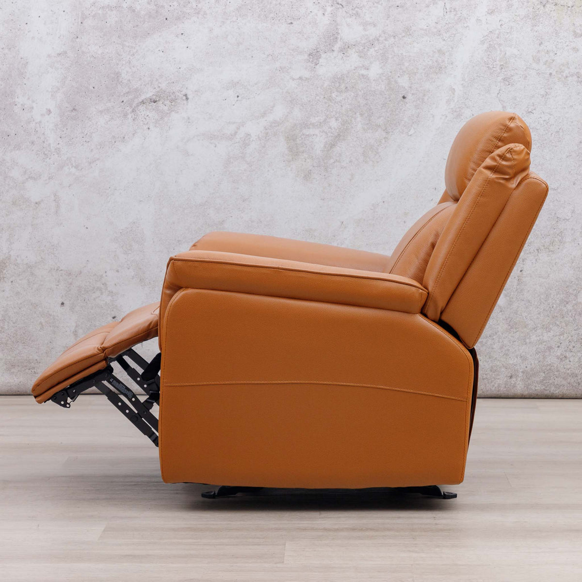 Side view of the Leather Gallery Carter 1 Seater Leather Recliner Chair in Tan, shown with the footrest extended.