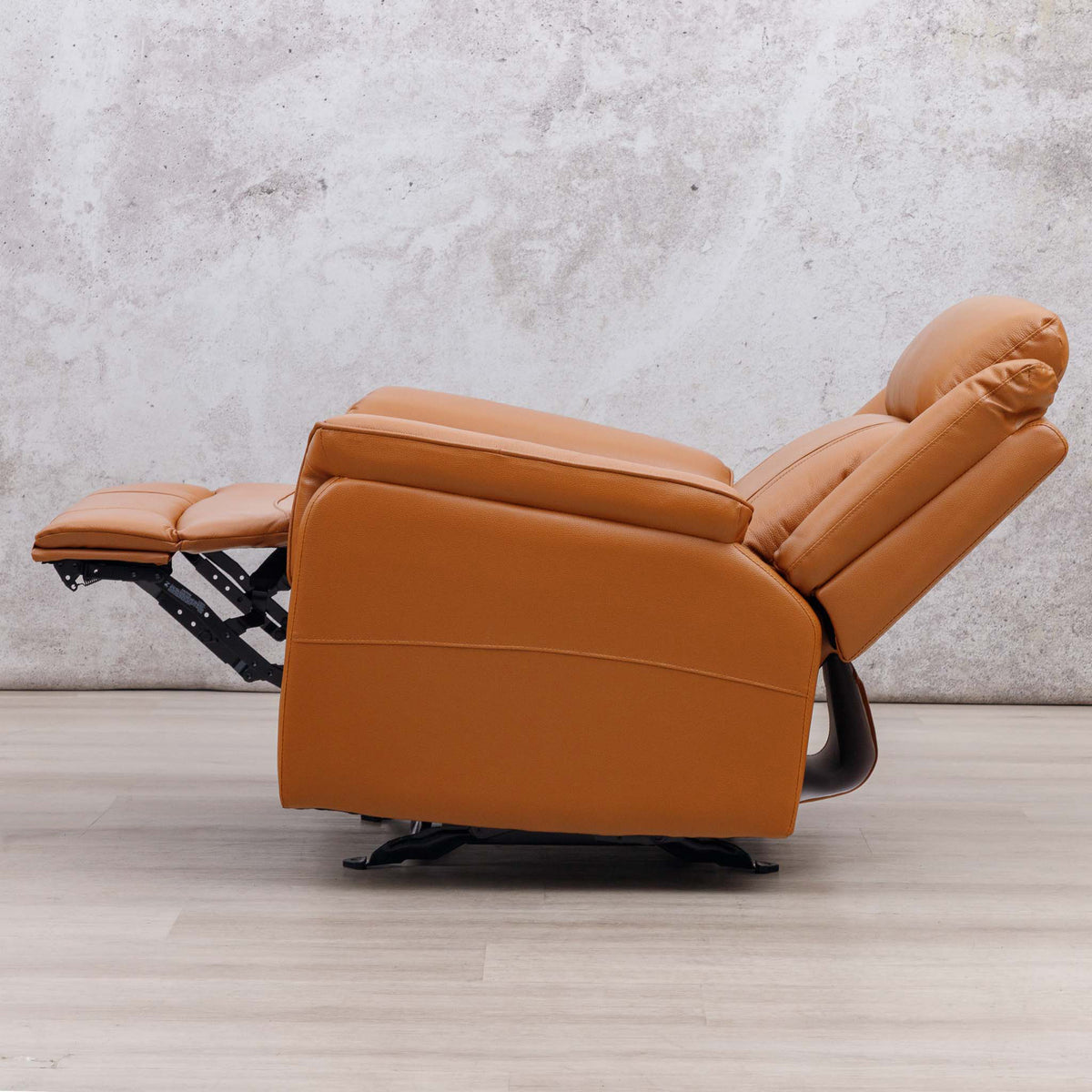 Side view of the Leather Gallery Carter 1 Seater Leather Recliner Chair in Tan, shown with the footrest extended.