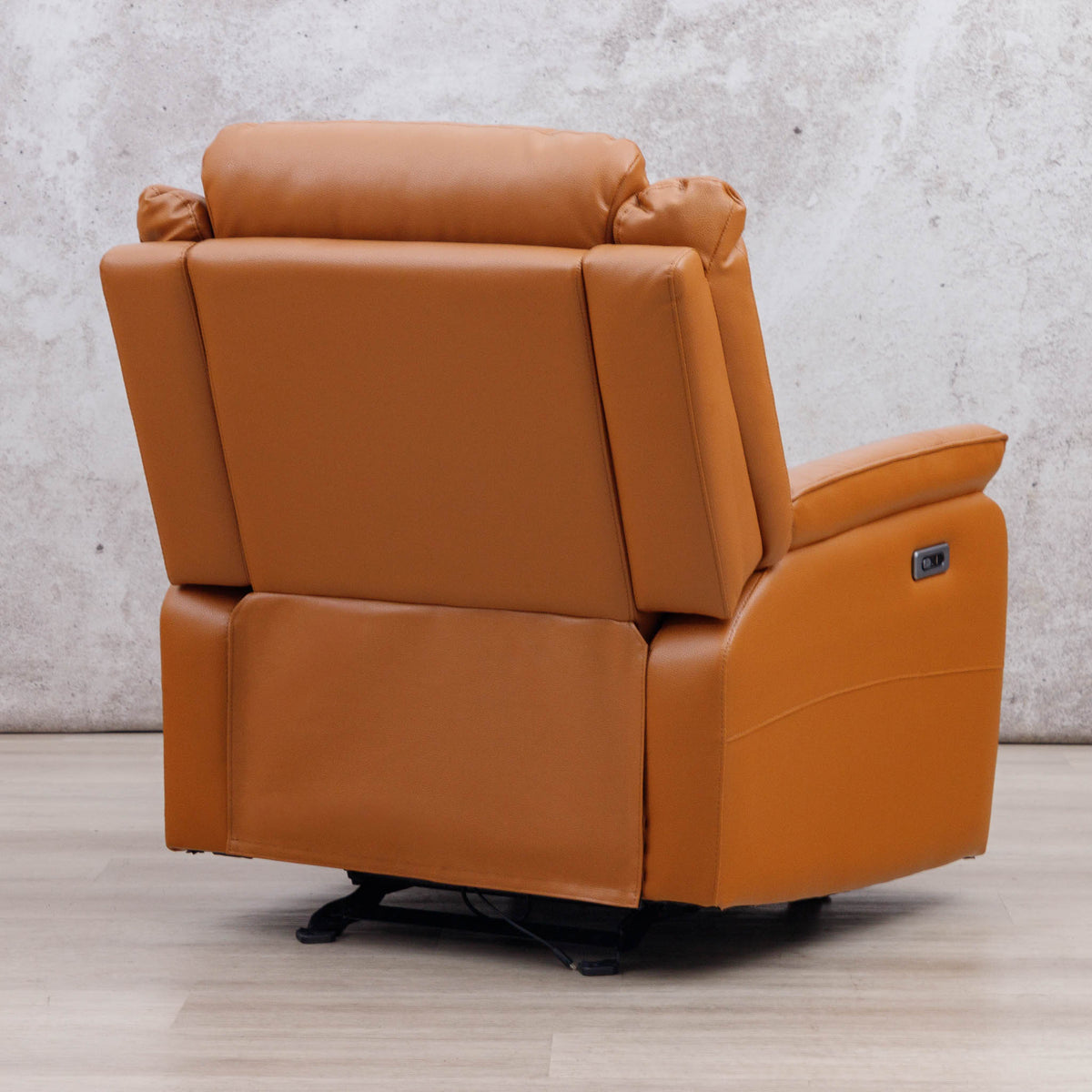 Rear three-quarter view of the Leather Gallery Carter 1 Seater Leather Recliner Chair in Tan, showing the side power control panel.