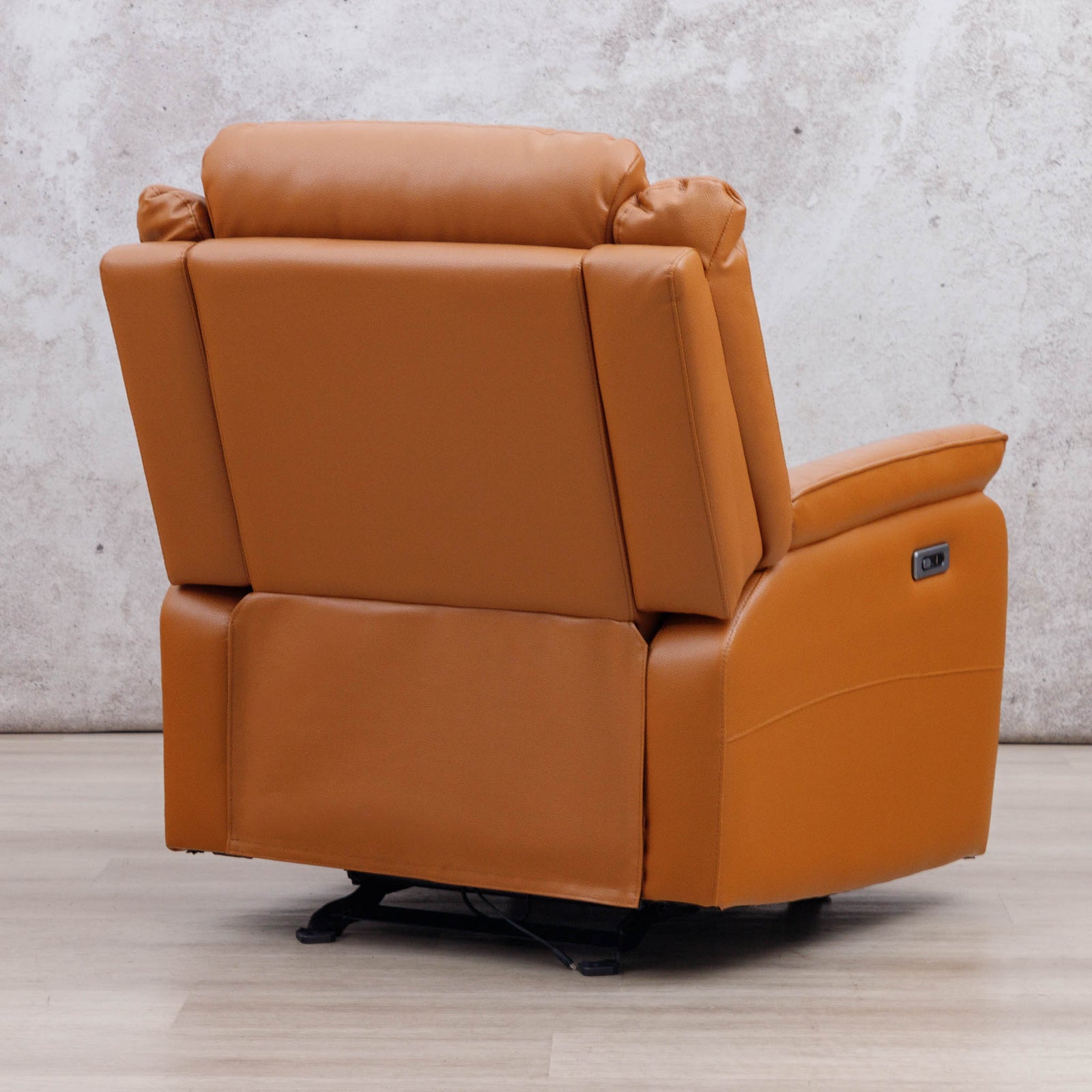 Rear three-quarter view of the Leather Gallery Carter 1 Seater Leather Recliner Chair in Tan, showing the side power control panel.
