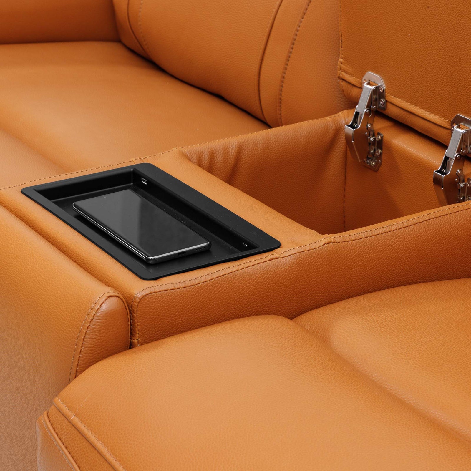 Close-up of the Leather Gallery Carter 1 Seater Leather Recliner Chair in Tan, showing the built-in storage tray, smartphone holder, and silver latch hardware.