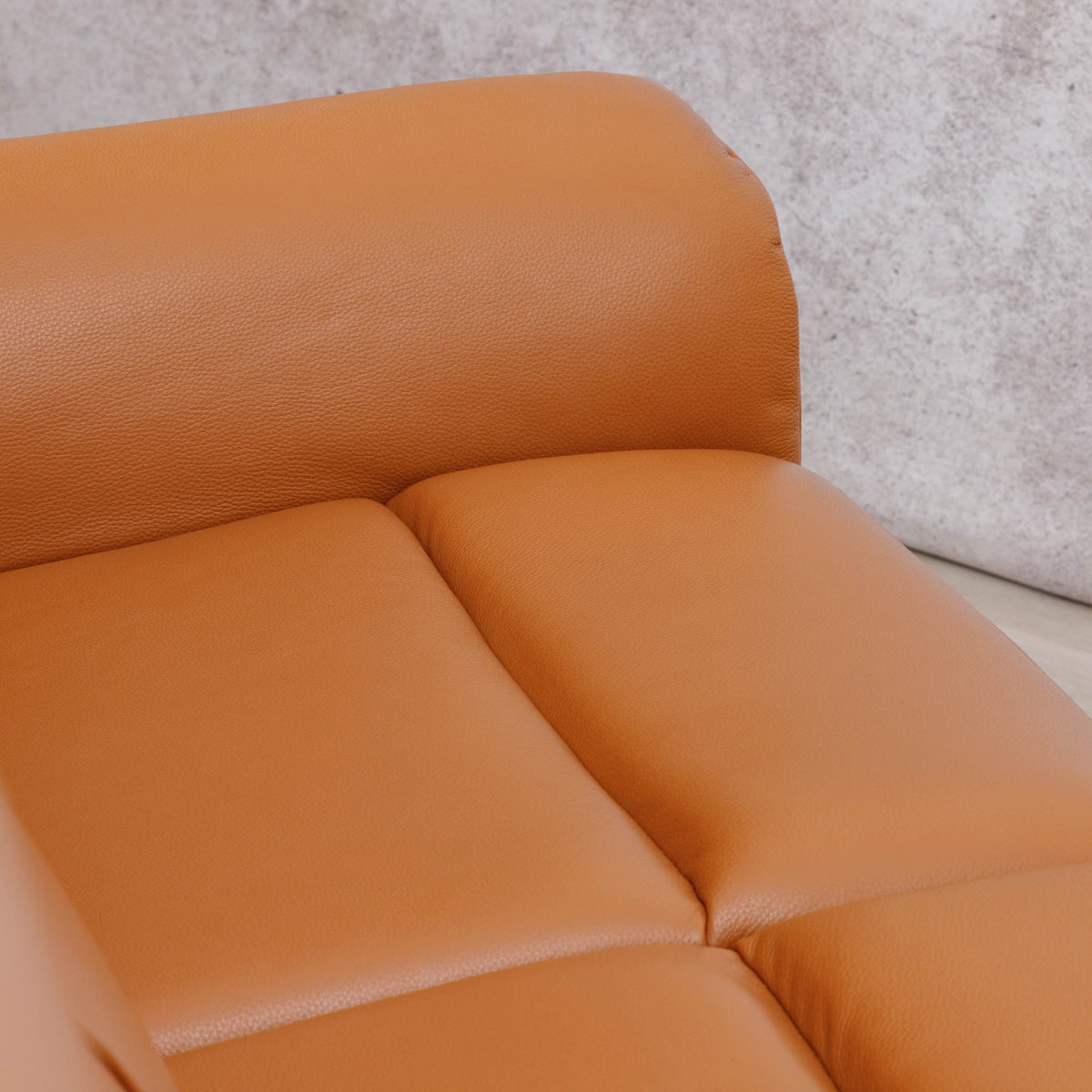 Close-up of the Leather Gallery Carter 1 Seater Leather Recliner Chair in Tan, showing the seat and back cushions with smooth leather upholstery.