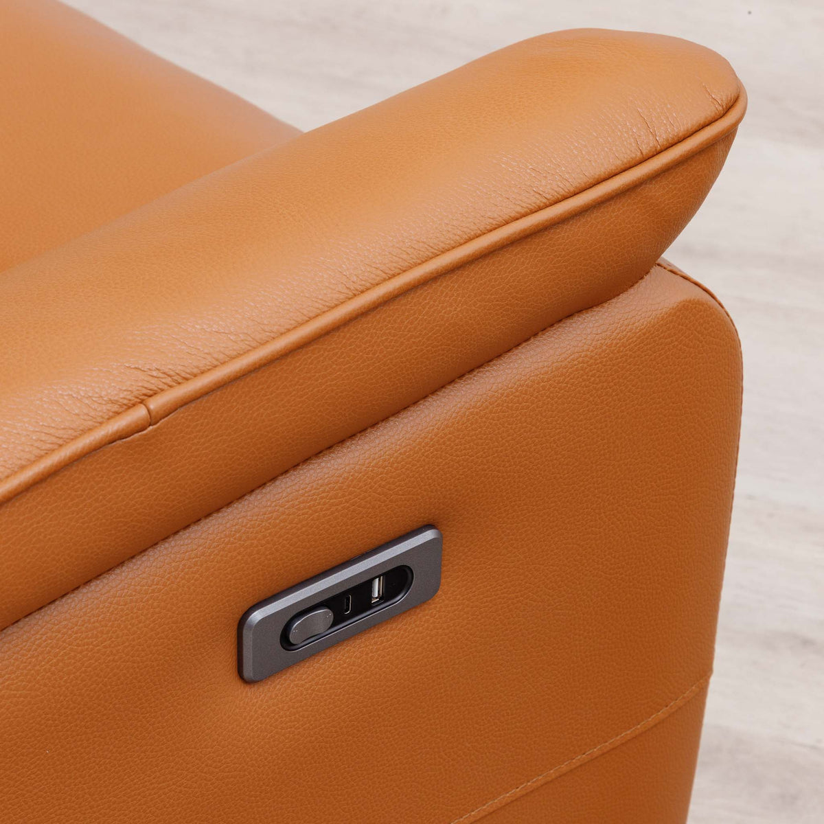 Close-up of the Leather Gallery Carter 1 Seater Leather Recliner Chair in Tan, showing the armrest and side control panel.
