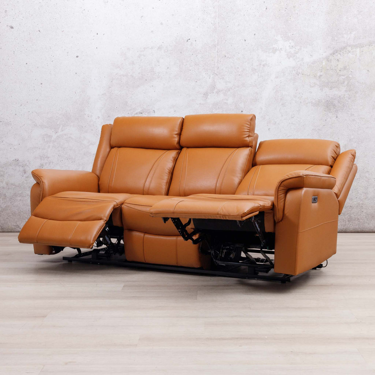 Leather Gallery Carter 3 Seater Leather Recliner in Tan, shown with the centre and left footrests extended.