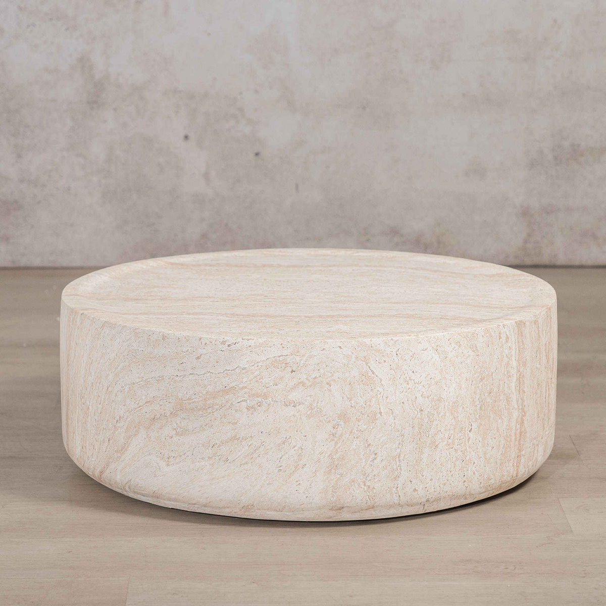 Gallery Everyday Cecilia Coffee Table in Seashell, featuring a round light beige travertine stone design in a bright modern living room.